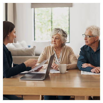 elderly couple talking about estate planning